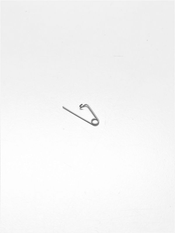 Lås för pinne till bromsbelägg